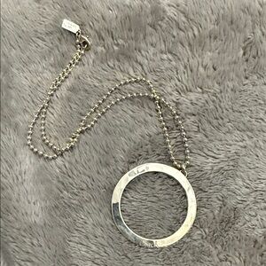 Coach Sterling Silver Circular Pendant Necklace